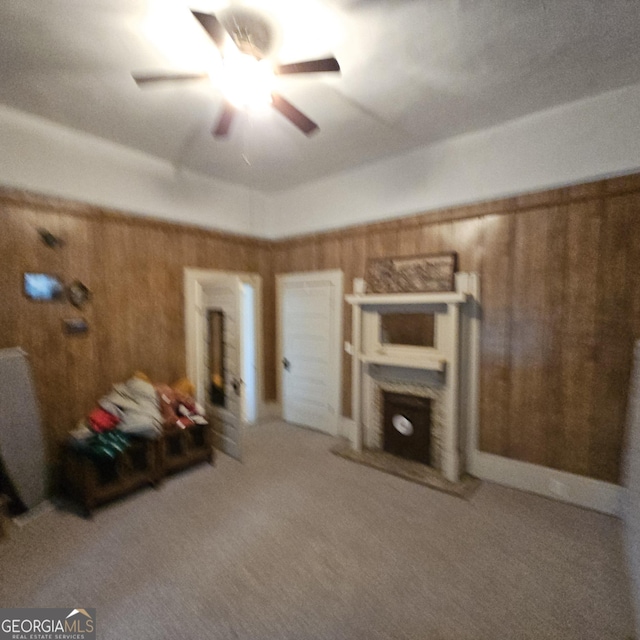 bedroom featuring carpet flooring and wooden walls