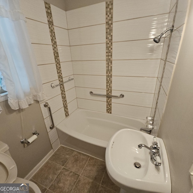 full bath featuring a sink, toilet, bathtub / shower combination, and tile patterned flooring