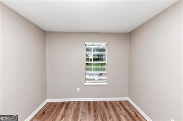 5290 Forest Downs Ln, Atlanta, GA 30349 - unfurnished room featuring wood finished floors and baseboards