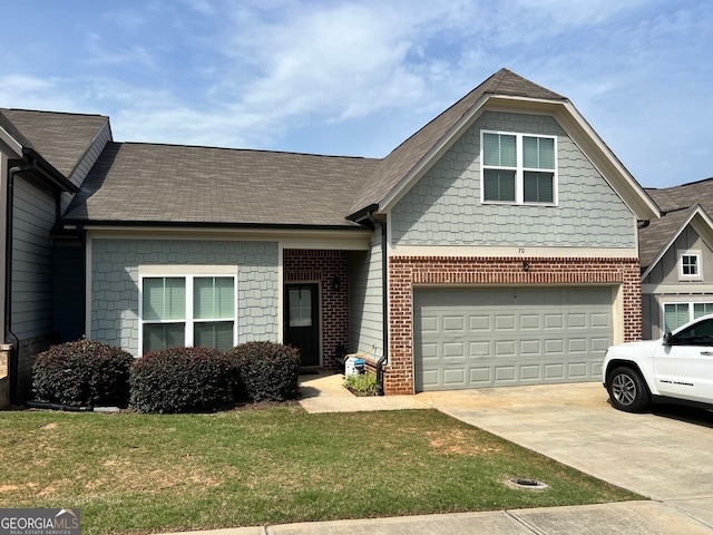 70 Wisteria Way, Winder, GA 30680 - view of front of home with concrete driveway, brick siding, a front lawn, and a shingled roof