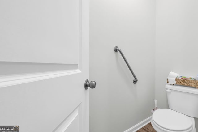 70 Wisteria Way, Winder, GA 30680 - bathroom with toilet, wood finished floors, and baseboards