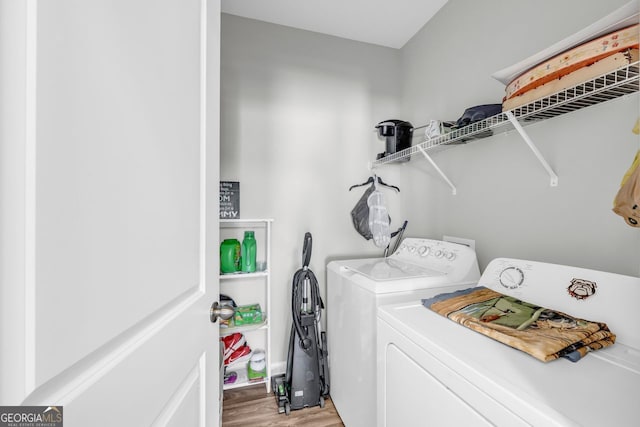 70 Wisteria Way, Winder, GA 30680 - laundry area featuring washing machine and clothes dryer and light wood-type flooring