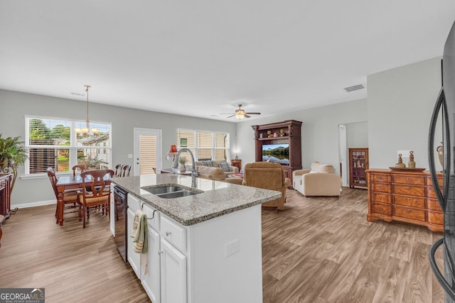 70 Wisteria Way, Winder, GA 30680 - kitchen featuring a sink, light wood finished floors, refrigerator, and ceiling fan