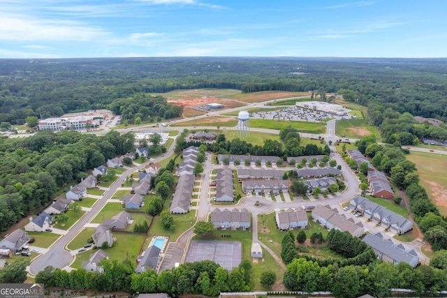 70 Wisteria Way, Winder, GA 30680 - aerial view of property and surrounding area with a heavily wooded area