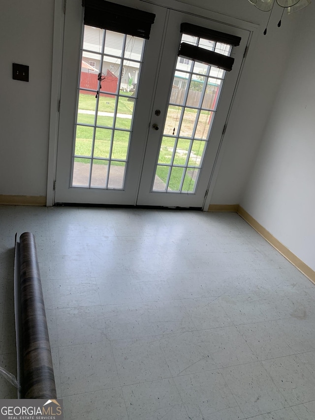 1625 Conley Rd Unit 139, Conley, GA 30288 - doorway to outside featuring baseboards, french doors, and light flooring