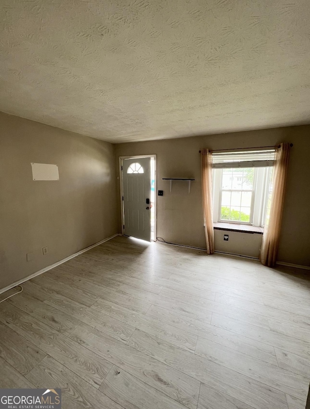 1625 Conley Rd Unit 139, Conley, GA 30288 - foyer with wood finished floors, a textured ceiling, and baseboards