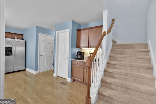1885 Hickory Station Cir, Snellville, GA 30078 - staircase with wood finished floors and baseboards