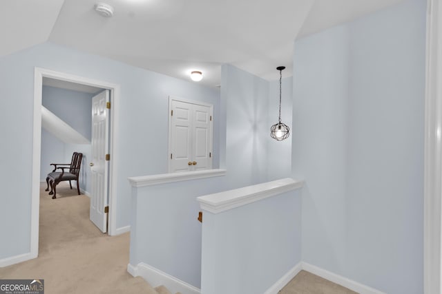1885 Hickory Station Cir, Snellville, GA 30078 - corridor featuring an upstairs landing, light carpet, and baseboards