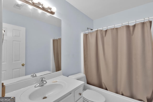 1885 Hickory Station Cir, Snellville, GA 30078 - full bath featuring vanity, toilet, and shower / bath combo with shower curtain