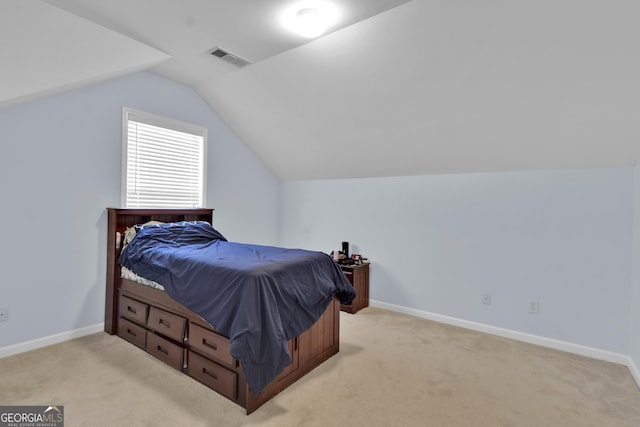 1885 Hickory Station Cir, Snellville, GA 30078 - bedroom featuring vaulted ceiling, light carpet, and baseboards