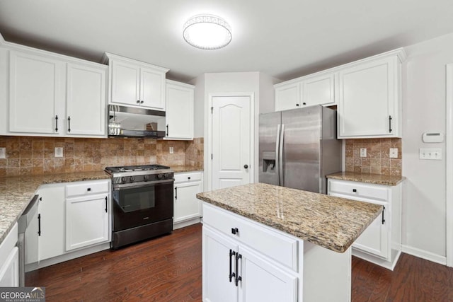 1736 Dylan Pl, Lawrenceville, GA 30043 - kitchen featuring stainless steel appliances, dark wood-style flooring, tasteful backsplash, and white cabinetry