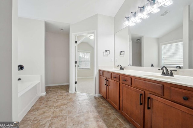 1736 Dylan Pl, Lawrenceville, GA 30043 - full bathroom with double vanity, a tub, and lofted ceiling