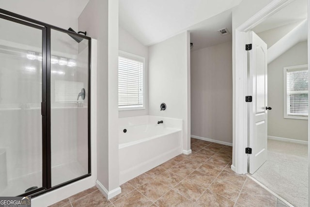 1736 Dylan Pl, Lawrenceville, GA 30043 - full bath with lofted ceiling, a shower stall, a garden tub, and tile patterned flooring