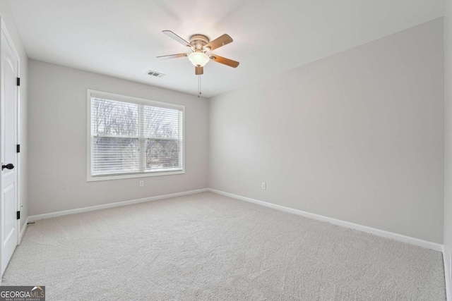 1736 Dylan Pl, Lawrenceville, GA 30043 - spare room featuring a ceiling fan and light colored carpet