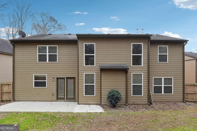1736 Dylan Pl, Lawrenceville, GA 30043 - back of house with a patio and a fenced backyard