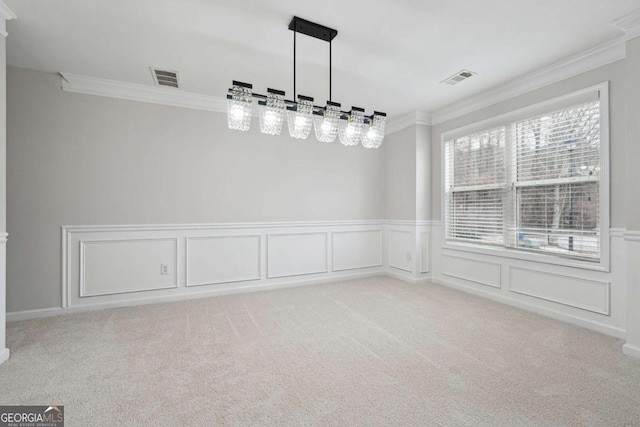 1736 Dylan Pl, Lawrenceville, GA 30043 - unfurnished dining area with ornamental molding, a wainscoted wall, carpet floors, and a decorative wall