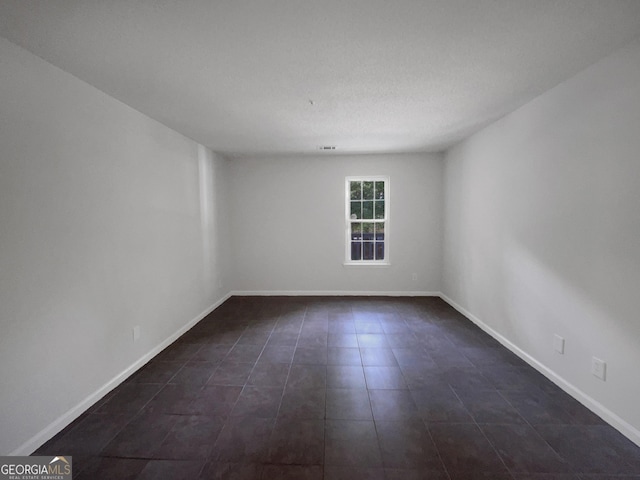 219 Cobblestone Trl, Avondale Estates, GA 30002 - spare room featuring baseboards and dark tile patterned flooring