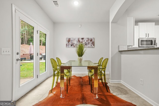 dining room featuring healthy amount of natural light and baseboards