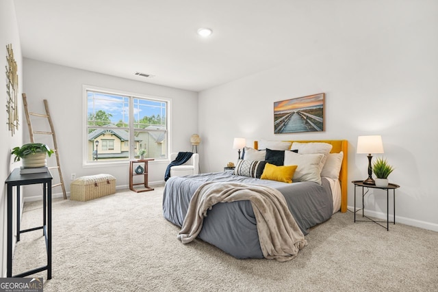 bedroom featuring carpet floors and baseboards