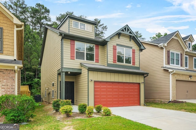 view of front of home featuring an attached garage, central AC unit, and concrete driveway