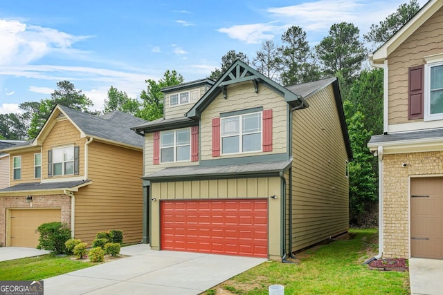 craftsman-style home with a garage, board and batten siding, and driveway