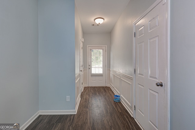 49 Torero Trl, Newnan, GA 30263 - doorway to outside featuring dark wood-style flooring and a wainscoted wall