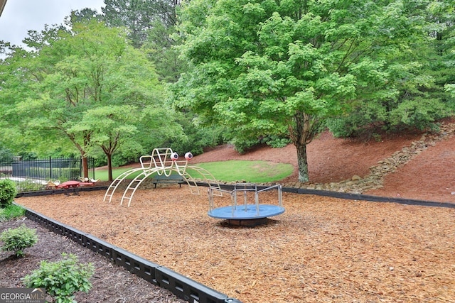 49 Torero Trl, Newnan, GA 30263 - community playground featuring fence and a trampoline