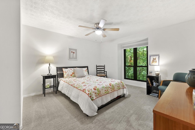 1424 Tuxworth Cir, Decatur, GA 30033 - bedroom with carpet flooring, baseboards, a textured ceiling, and a ceiling fan