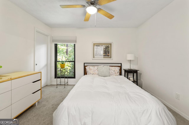 1424 Tuxworth Cir, Decatur, GA 30033 - bedroom featuring light carpet, baseboards, and a ceiling fan