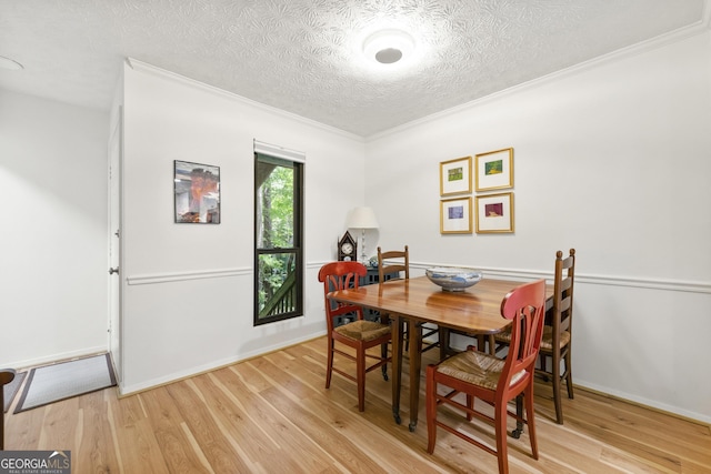 1424 Tuxworth Cir, Decatur, GA 30033 - dining area with light wood-style flooring, a textured ceiling, and ornamental molding