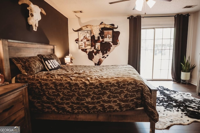 bedroom featuring wood finished floors and a ceiling fan