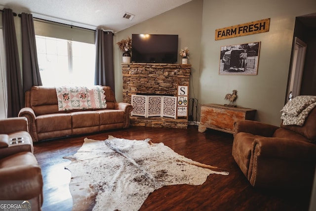 living room featuring wood finished floors and vaulted ceiling