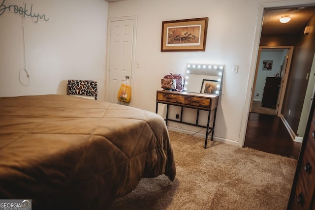 carpeted bedroom with baseboards