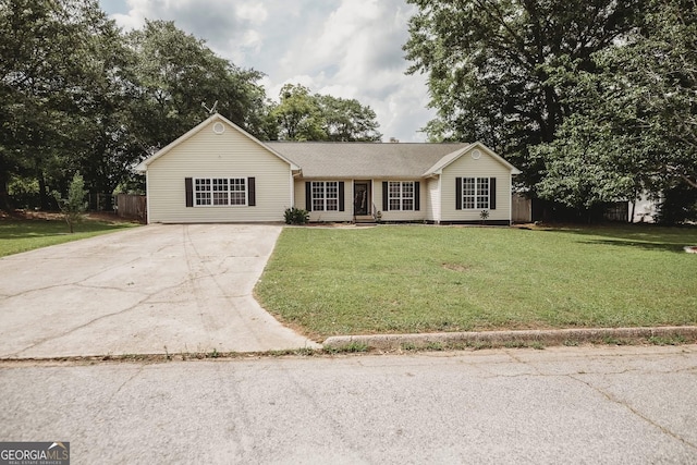 ranch-style home featuring concrete driveway