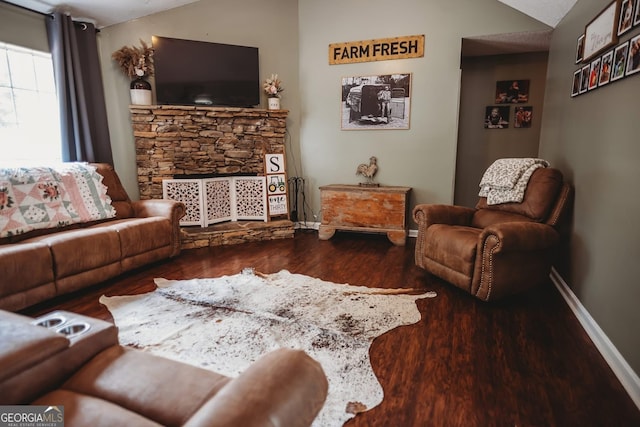 living room featuring wood finished floors and baseboards