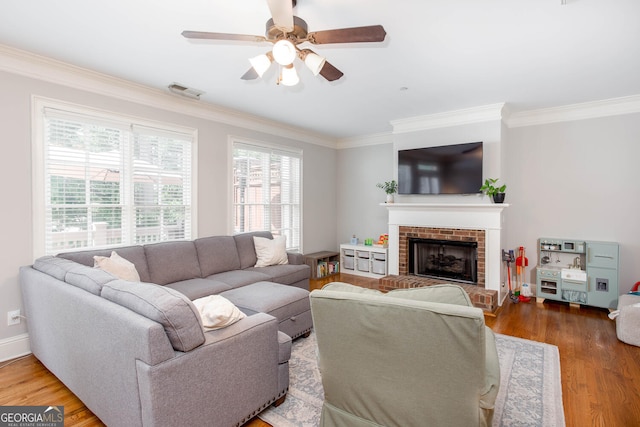 855 Mountain View Ter NW, Marietta, GA 30064 - living area featuring crown molding, wood finished floors, ceiling fan, a fireplace, and baseboards