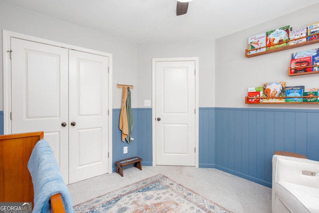 855 Mountain View Ter NW, Marietta, GA 30064 - bedroom featuring a wainscoted wall, a closet, carpet, and ceiling fan