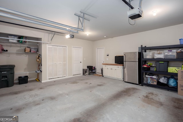 855 Mountain View Ter NW, Marietta, GA 30064 - garage featuring freestanding refrigerator and a garage door opener