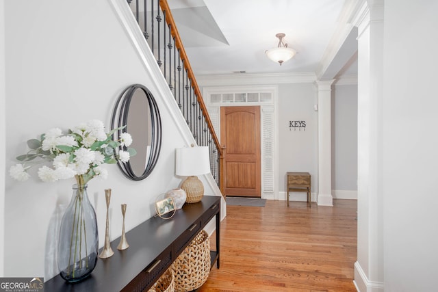 855 Mountain View Ter NW, Marietta, GA 30064 - entryway with light wood-style floors, stairs, ornamental molding, ornate columns, and baseboards