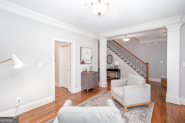 855 Mountain View Ter NW, Marietta, GA 30064 - living area featuring decorative columns, ornamental molding, stairs, wood finished floors, and baseboards