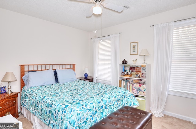 bedroom featuring carpet flooring, baseboards, and a ceiling fan