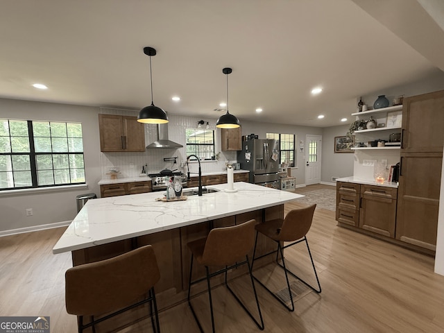 kitchen with stainless steel appliances, baseboards, recessed lighting, light wood-type flooring, and open shelves
