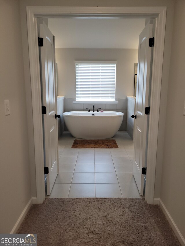 436 Lothbury Ave, Locust Grove, GA 30248 - full bath with a freestanding bath and tile patterned flooring