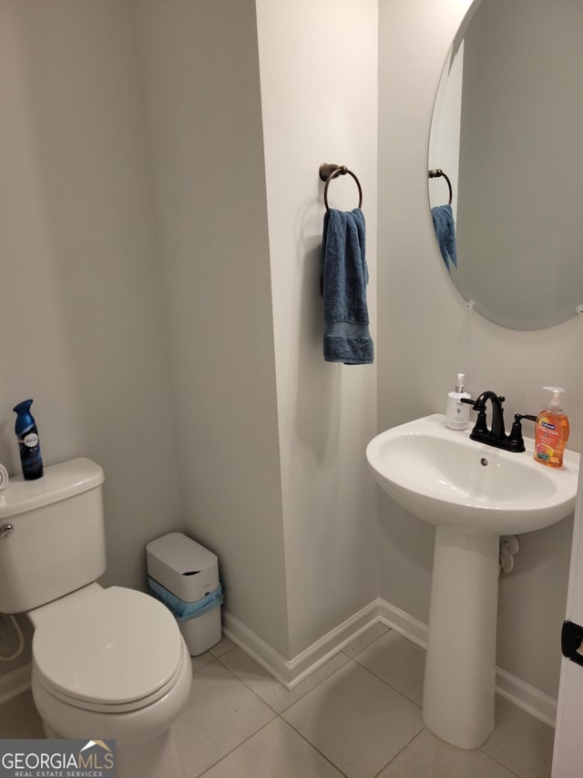 436 Lothbury Ave, Locust Grove, GA 30248 - half bathroom featuring toilet, tile patterned floors, and baseboards