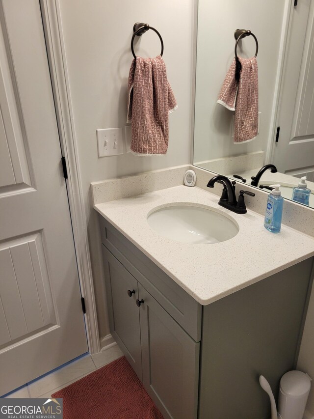 436 Lothbury Ave, Locust Grove, GA 30248 - bathroom with tile patterned flooring and vanity