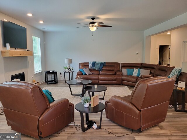 436 Lothbury Ave, Locust Grove, GA 30248 - living room with a ceiling fan, light wood finished floors, a fireplace, and recessed lighting
