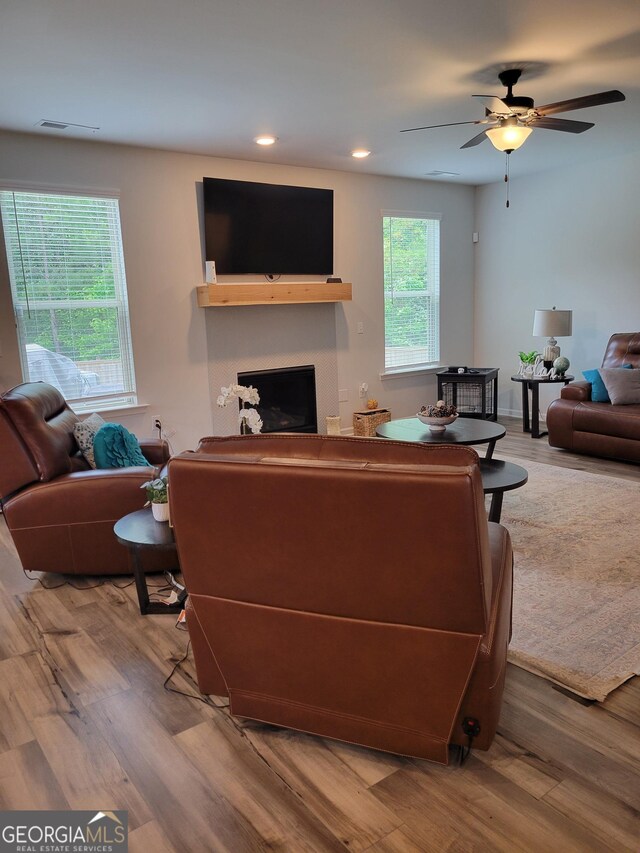 436 Lothbury Ave, Locust Grove, GA 30248 - living area with wood finished floors, recessed lighting, ceiling fan, and a fireplace