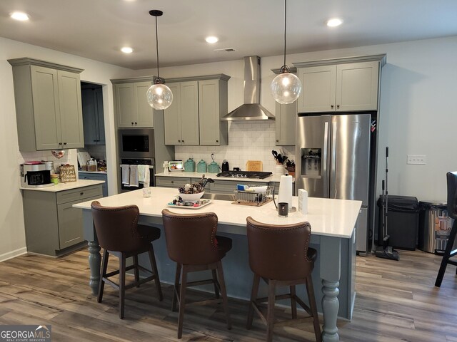 436 Lothbury Ave, Locust Grove, GA 30248 - kitchen featuring wall chimney range hood, appliances with stainless steel finishes, gray cabinets, backsplash, and recessed lighting
