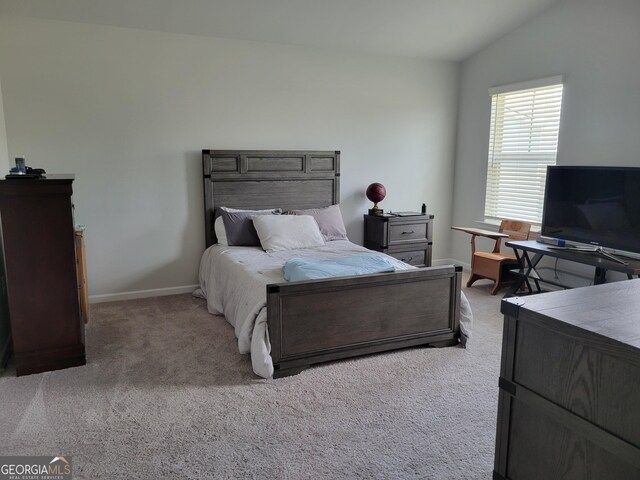 436 Lothbury Ave, Locust Grove, GA 30248 - bedroom featuring vaulted ceiling, carpet flooring, and baseboards