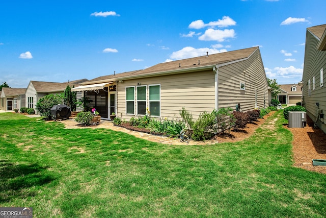 733 Firefly Ct, Griffin, GA 30223 - rear view of house with a lawn and central air condition unit